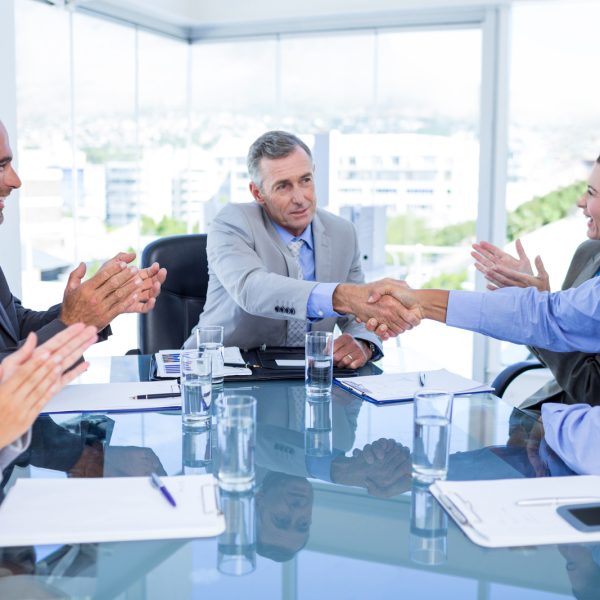 Business boardroom meeting shaking hands image